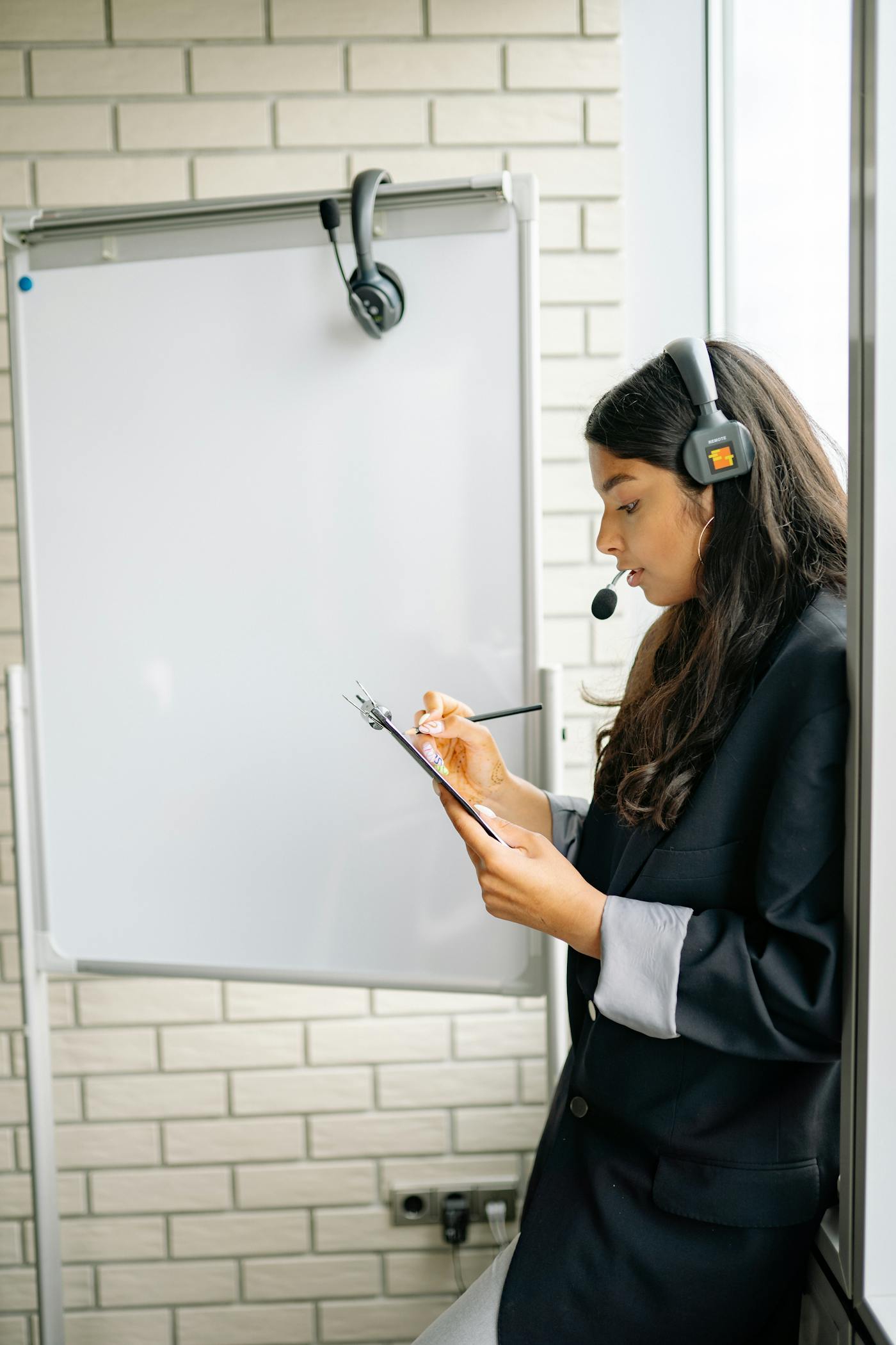 Person smiling while working on a laptop during a customer support workflow