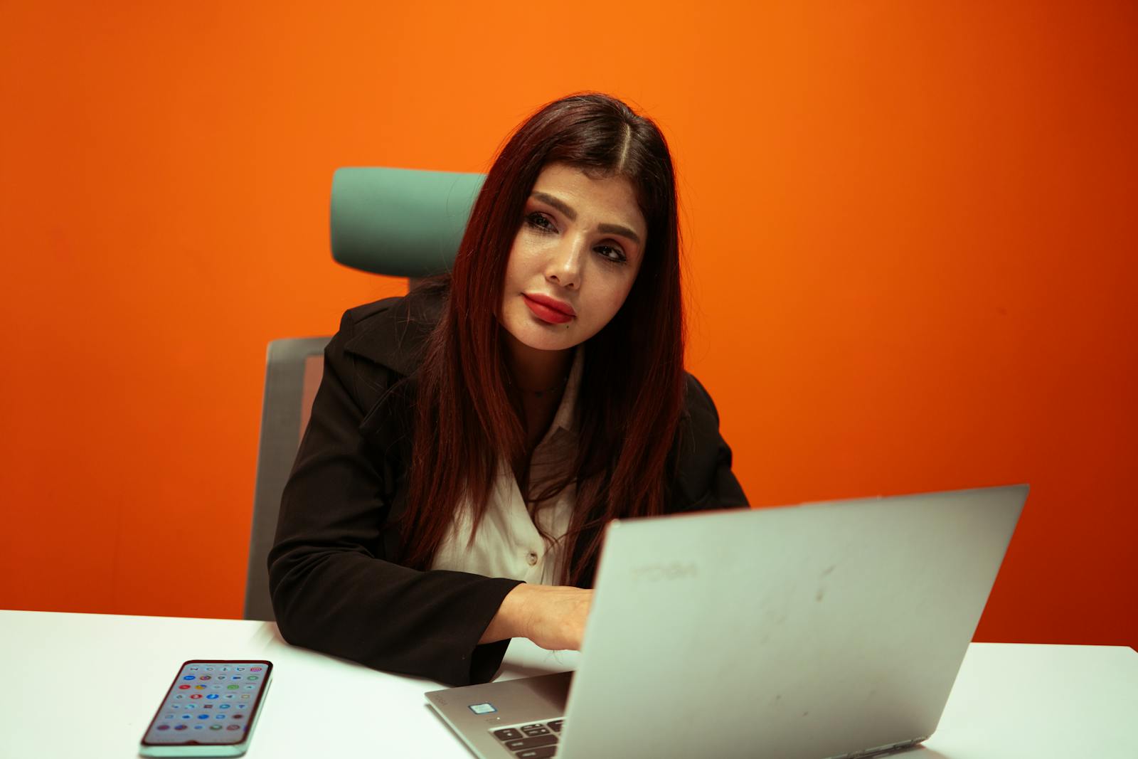 Business professional working on a laptop in a modern office